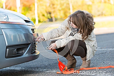 Woman assembling towing hook Stock Photo