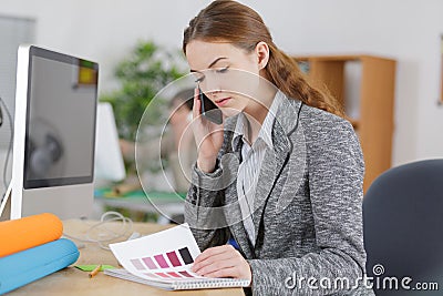 Woman assisting client on phone Stock Photo