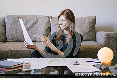 Woman astrologist conducts a consultation at home. Stock Photo