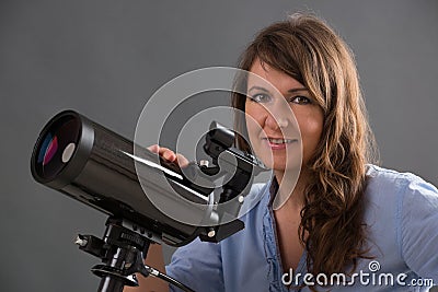 Woman with astronomical telescope Stock Photo