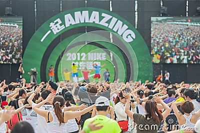 Woman athlete doing exercise in the Nike's Be Amazing 5K race event Editorial Stock Photo