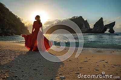 Woman at Atuh beach at Nusa Penida Island, Bali, Indonesia Stock Photo