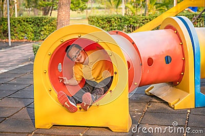 Woman with autistic or down syndrome playing at playground in park Stock Photo