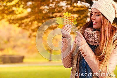 Woman in autumn park holding vitamins medicines Stock Photo