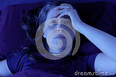 Woman awake bed night insomnia Stock Photo