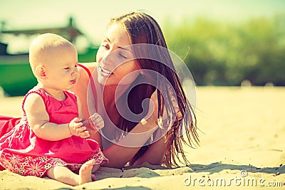 Woman and baby on beach Stock Photo