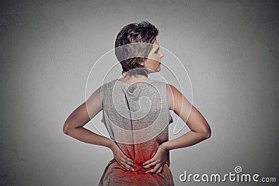 Woman with backache lower back pain colored in red Stock Photo