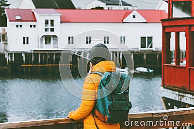 Woman with backpack traveling in Norway sightseeing Travel Lifestyle concept adventure Stock Photo