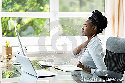 Woman With Bad Posture And Ergonomics Stock Photo