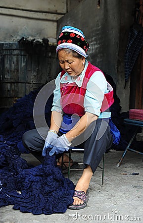 A woman of Bai ethnic minority making batik Editorial Stock Photo