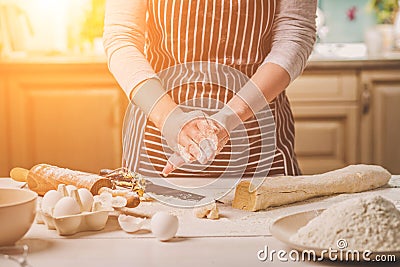 Woman bake pies. Confectioner makes desserts. Making buns. Dough on the table. Knead the dough. Stock Photo