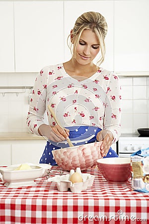 Woman Baking In Kitchen Stock Photo