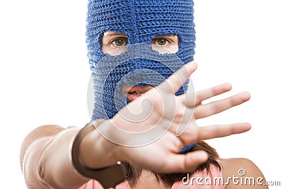 Woman in balaclava hiding face Stock Photo