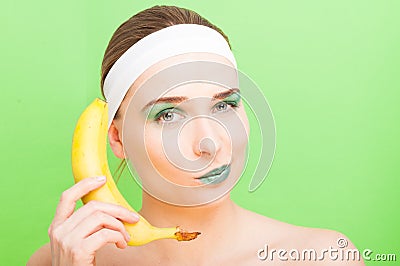Woman with banana having fun Stock Photo