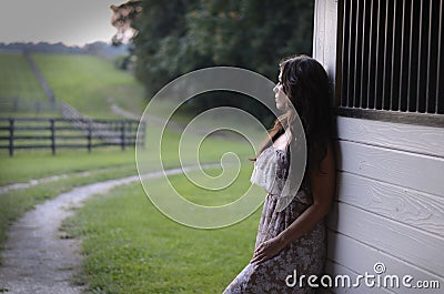 Woman in a Barn Stock Photo