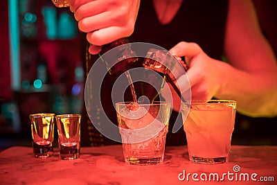 Bartender Pouring alcohol and soda Stock Photo