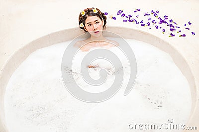 Woman bathing in a spa bath Stock Photo