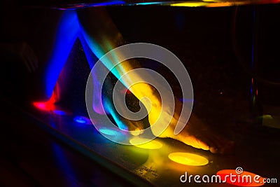 Woman bathing in spa with color therapy Stock Photo