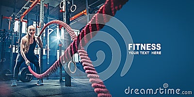 Woman with battle rope battle ropes exercise in the fitness gym. Stock Photo