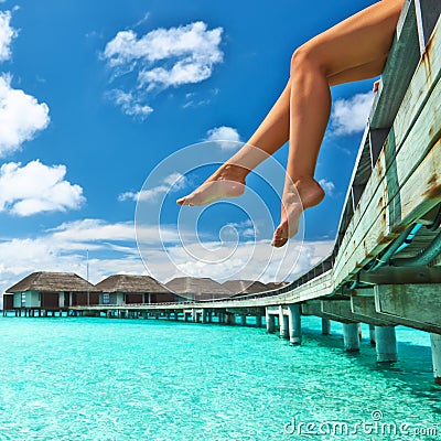 Woman at beach jetty Stock Photo