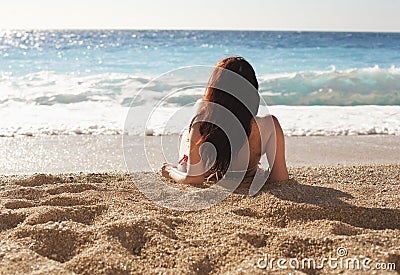 Woman at the beach Stock Photo