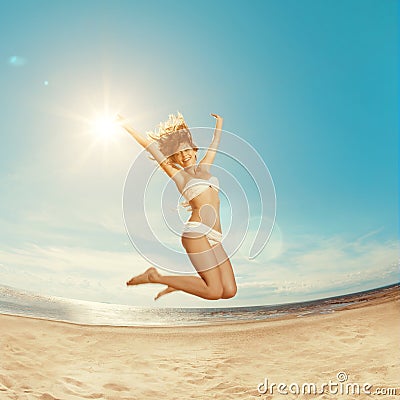 Woman on the beach. Young girl on the sand by sea. Stylish beaut Stock Photo