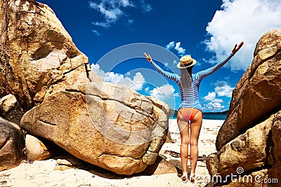 Woman at beautiful beach wearing rash guard Stock Photo