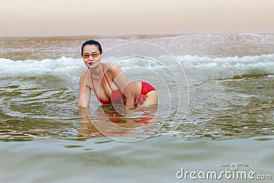 Woman beautiful breast happy with red bikini Stock Photo