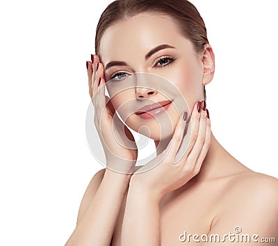 Woman with beautiful face, healthy skin and her hair on a back touching her face with fingers close up portrait studio on white Stock Photo