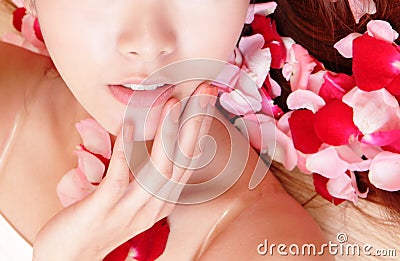 Woman beautiful lips with pink and red roses Stock Photo