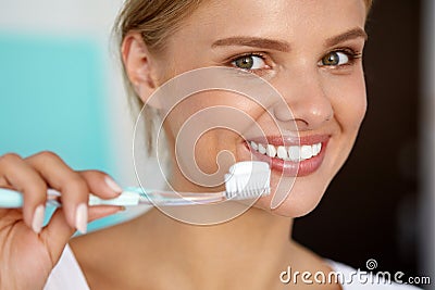 Woman With Beautiful Smile, Healthy White Teeth With Toothbrush Stock Photo