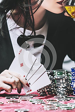 Woman beautiful young successful gambling in a casino at a table Stock Photo