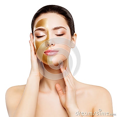 Woman Beauty Gold Mask , Beautiful Girl applying Golden Skin Cosmetic to Face Stock Photo