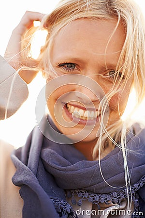 Woman, beauty and portrait with smile in sunshine, outdoor or spring fashion or happiness. Closeup, wind and natural Stock Photo