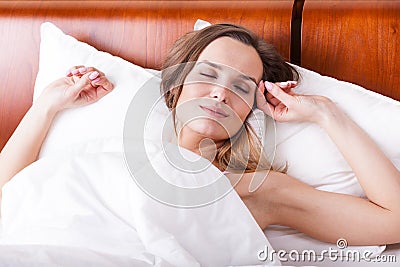 Woman in bed with sweet dreams Stock Photo