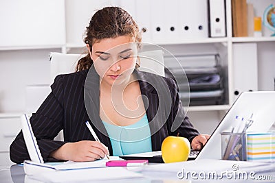 Woman beginner is having productive day at work Stock Photo