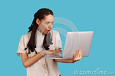 Woman being shocked operational software problems, afraids of data loss, gets error message. Stock Photo