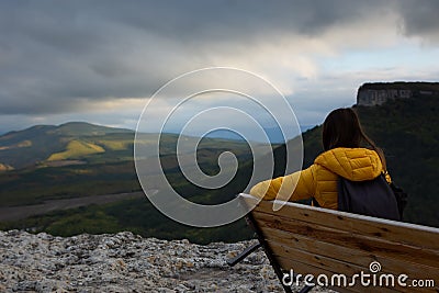 Woman bench mountain. a thoughtful woman traveler Stock Photo