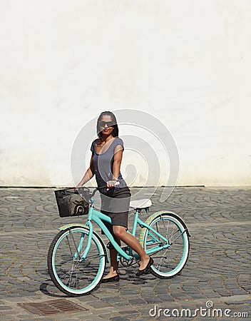 Woman With A Bicycle In A City Stock Photo