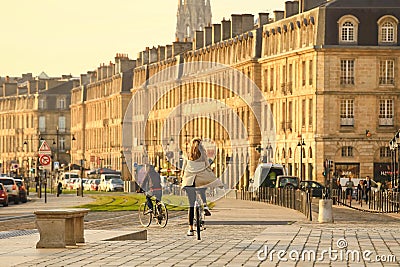 woman on bicycle at Place de la Bourse in Bordeaux city Editorial Stock Photo