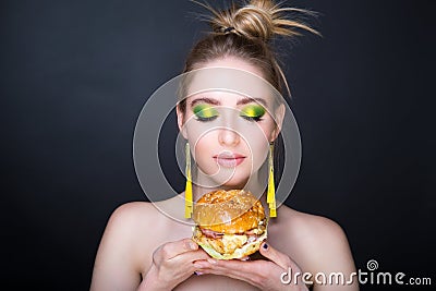 Woman with big hamburger Stock Photo