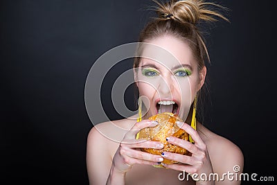 Woman with big hamburger Stock Photo