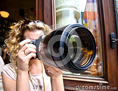 Woman with a big zoom Stock Photo