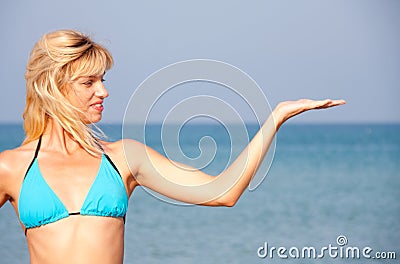 Woman in bikini presenting the sea vacation Stock Photo