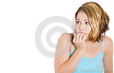 Woman biting her nails and looking to the side with a craving for something or anxious Stock Photo