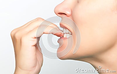 Woman biting nails Stock Photo