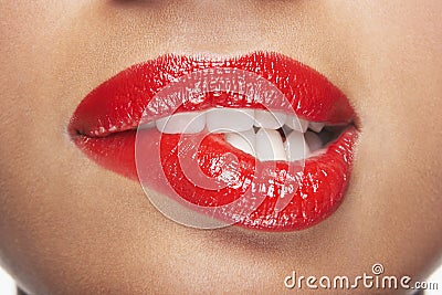 Woman Biting Red Lips Stock Photo