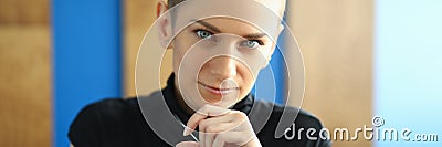 Woman in a black dress with a medallion close-up Stock Photo
