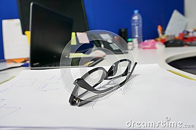 Woman black glasses on the office desk Stock Photo