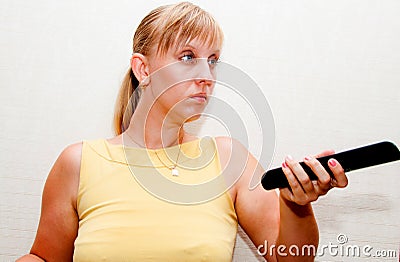 Woman with black remote Stock Photo